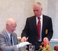 Steve has Keith try on a wrist and hand pad